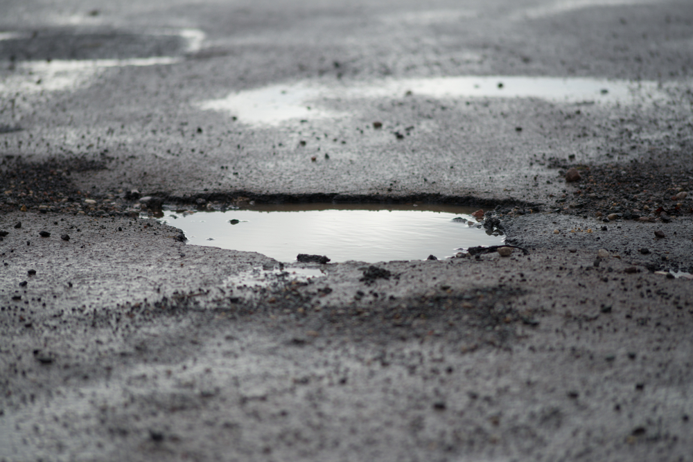 asphalt damage corrugations potholes